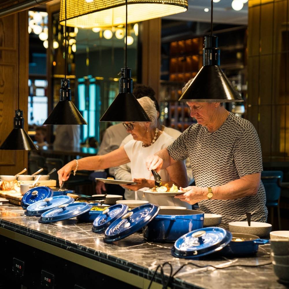 Buffet breakfast Guests serving food at buffet